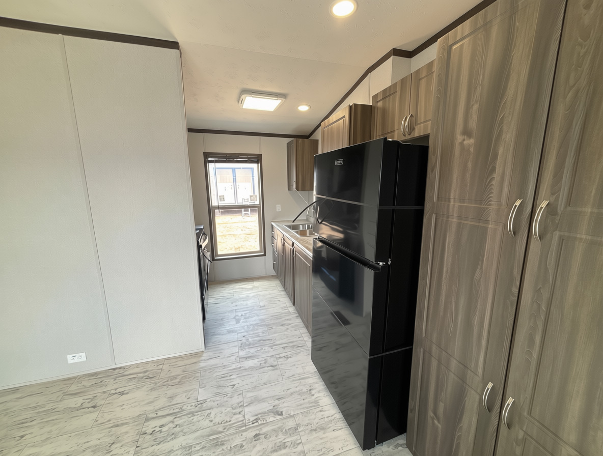 Kitchen cabinets and sink inside an H-2A unit